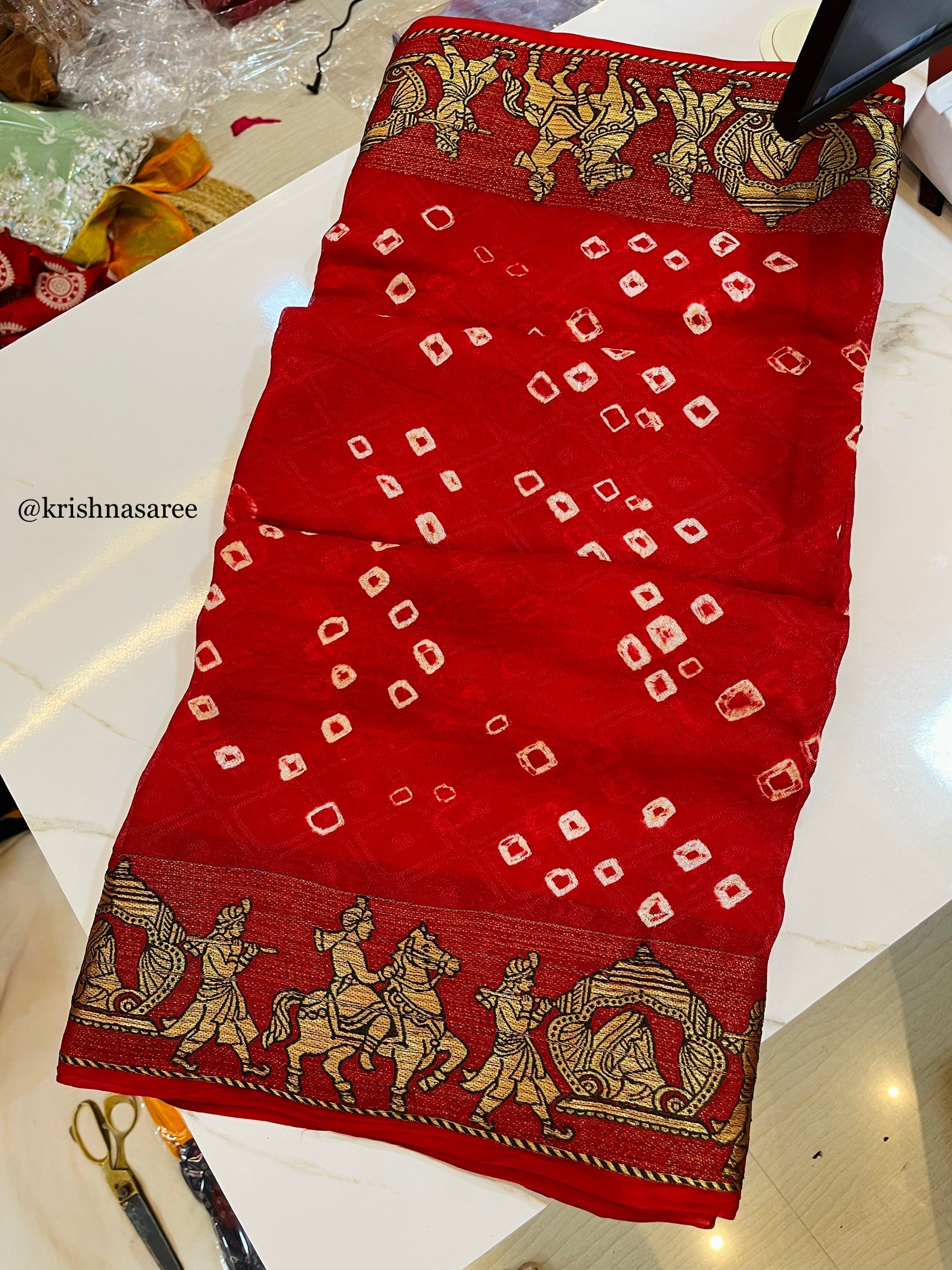 Brasso Fabric Saree With Hand Bandhani And Weaving Border